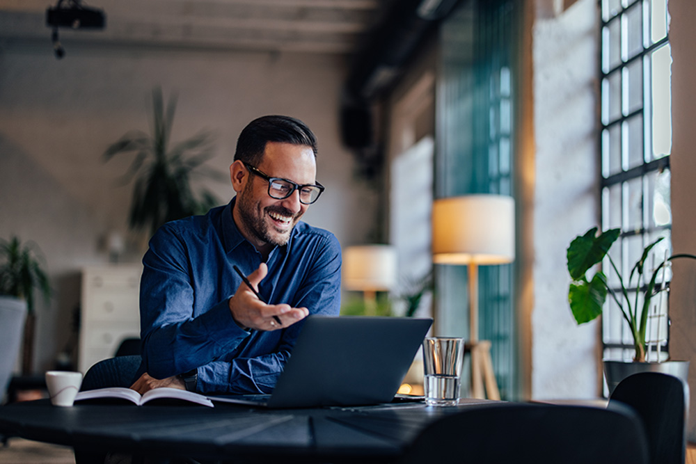 Male employer having an online meeting